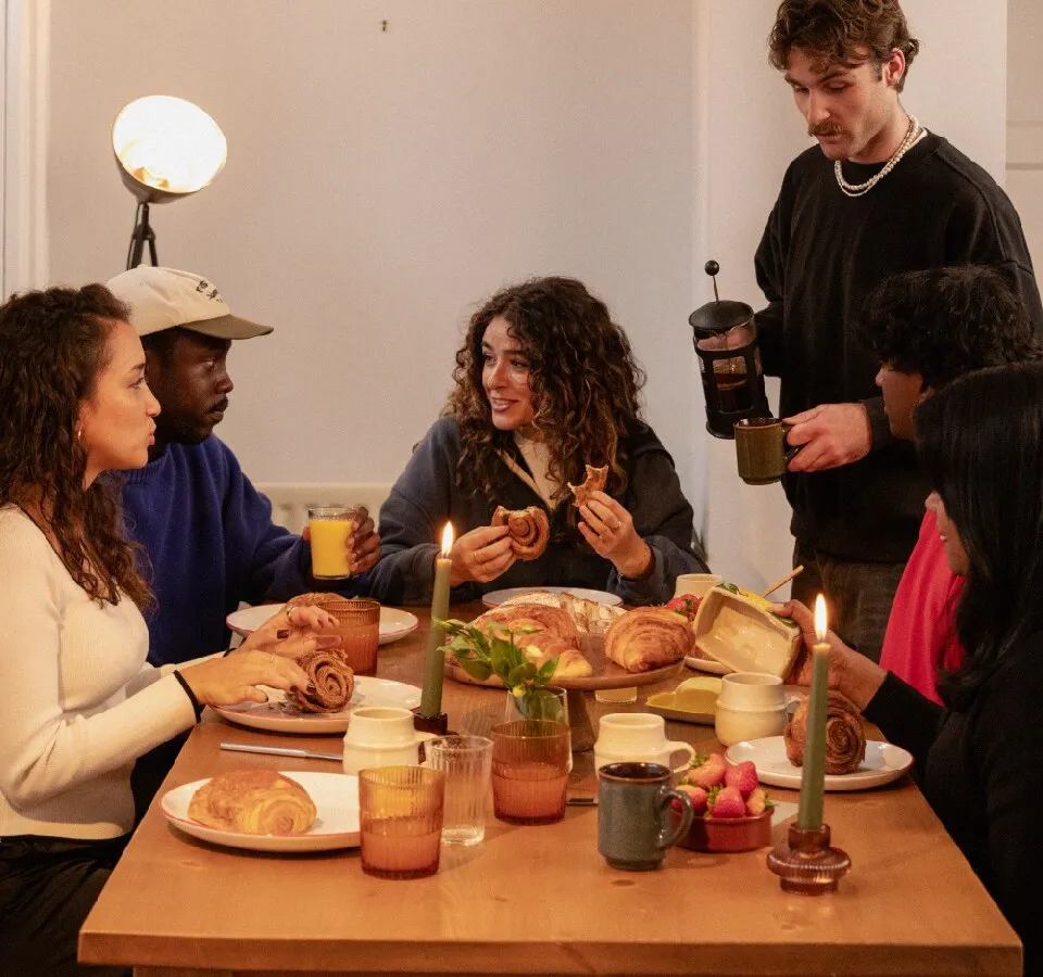A small group talking around a table
